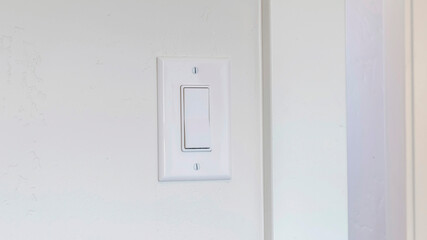 Panorama frame Indoor electrical light switch of home mounted on white wall background