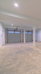 Vertical Large white clean empty garage for cars