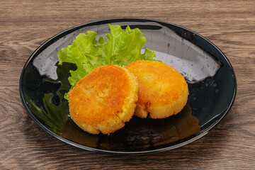 Vegan cuisine - Potato cutlet in the plate