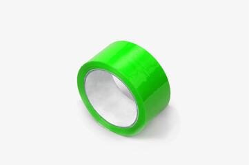 green adhesive tape in a roll on a white background. Subject photography.