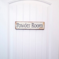 Square crop White panelled door with rustic rectangular wooden Powder Room sign