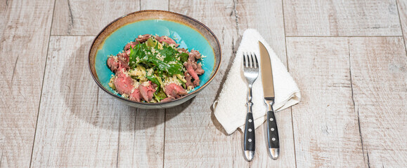 Tasty and healthy salad with roast beef
