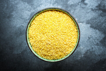 bulgur fine crushed raw grain Menu concept serving size. food background top view copy space for text organic healthy eating keto or paleo diet