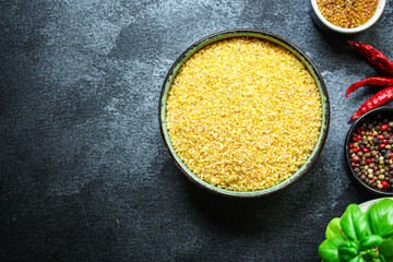 bulgur fine crushed raw grain Menu concept serving size. food background top view copy space for text organic healthy eating keto or paleo diet