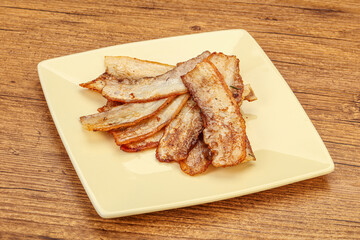 Roasted juicy bacon in the plate