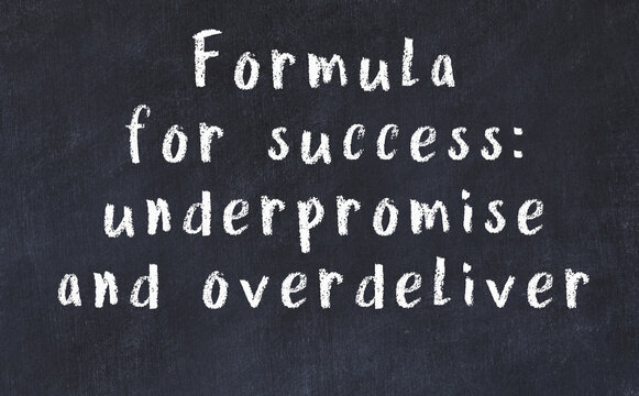 Chalk inscription of smart quote on black desk