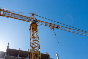 tower crane and construction of a multi-story building. Construction concept