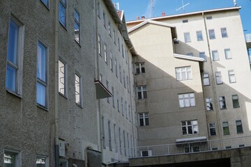 Fototapeta premium Abandoned mental hospital below blue summer sky. Abandoned infrastructure.