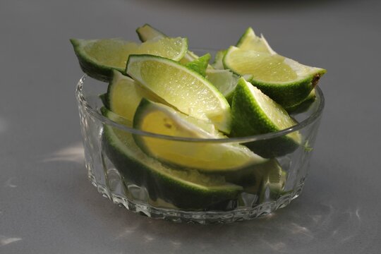 Closeup Shot Of The Sliced Fresh Limes On The Glass Bowl