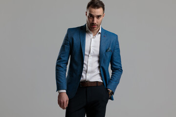 confident smartcasual model holding hand in pocket