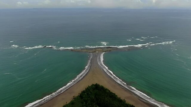 Beautiful cinematic aerial footage of the Whale Tale beach in the Marino Ballena National Park in Costa Rica