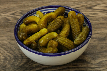 Pickled gherkin in the bowl