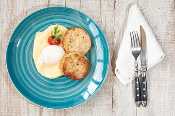 Mashed potatoes, poached egg, tomato, dill, meatballs