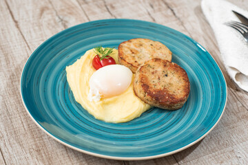 Mashed potatoes, poached egg, tomato, dill, meatballs