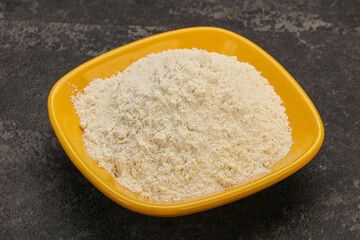 Wheat flour heap in the bowl