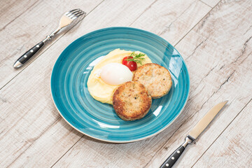 Mashed potatoes, poached egg, tomato, dill, meatballs