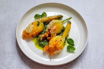 Fried courgette flowers stuffed with ricotta cheese in light tempura batter