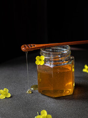 Natural homemade honey with yellow flower 