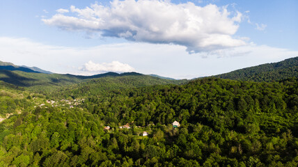 Beautiful landscape view of the valley. Trees, river and mountain range in the background. Clear sky, Sunny spring day. Drone shot
A bird's-eye view of the landscape. drone photography