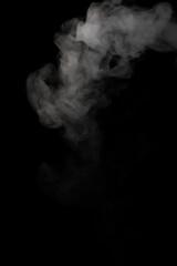 A stream of white smoke on a black background mixes randomly creating bizarre swirl patterns