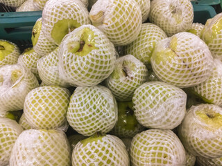 Pile of Guava wrap in foam packing on sale at the supermarket.