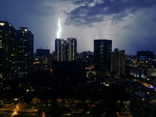 Fototapeta na wymiar Thunderstorm over Singapore at night - October 2017