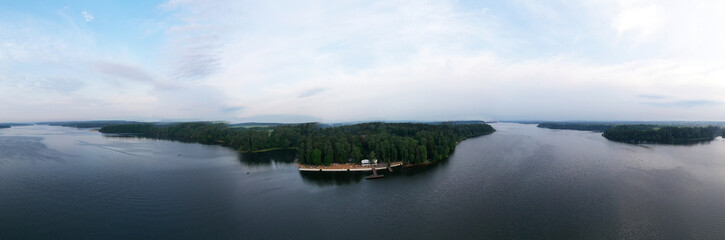 Fototapeta premium boat mooring on the river at sunrise filmed from a drone