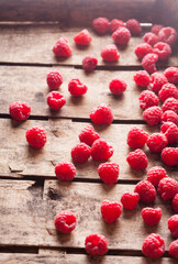 Raspberries fresh colorful overhead arrangement in old rustic wooden box on bright light selective focus studio shot