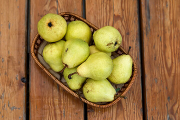 Yellow pears on the wooden table from the top