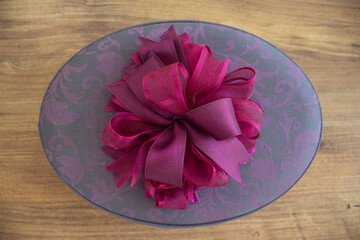box with pink ribbon