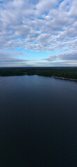 panoramic view of the river with floating boats and beautiful clouds shot from a drone