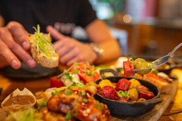 Tapas platter on a table being eaten at a Spanish restaurant
