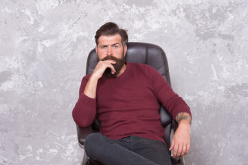 Beard is hairy extension of man. Bearded man relax in armchair. Brutal man in casual style. Mens...