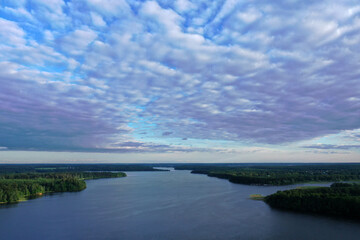panoramic view of the river with floating boats and beautiful clouds shot from a drone