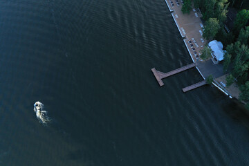 boat mooring on the river at sunrise filmed from a drone