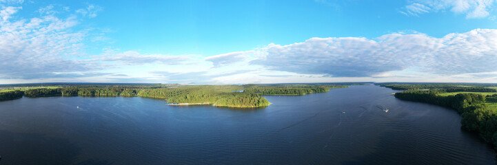 panoramic view of the river with floating boats and beautiful clouds shot from a drone