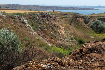 Abandoned garbage pollutes nature. The concept of the environmental problem of nature trash pollution. Civilization Problem of waste disposal in the modern world