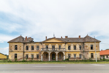 Fototapeta na wymiar Vlajkovac, Serbia - June 04, 2020: Bissingen-Nipenburg Castle in Vlajkovac, Serbia. It was erected in 1859 and is a cultural monument of great importance. Abandoned castle