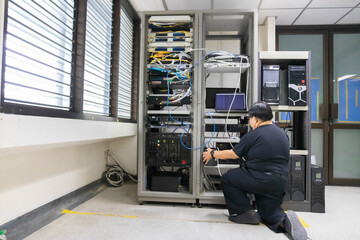 The system administrator works in the server room of the data center.