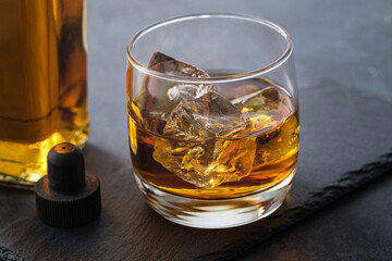 Close-up whiskey glass with cubes