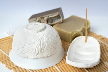 Modeling air dry clay bowl and soap dish on a bamboo mat