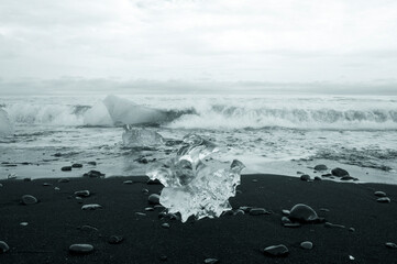 small pieces of ice at volcano black beach iceland
