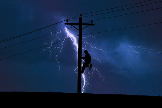 Lineman working in Lightning Storm