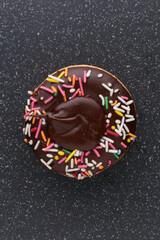  donut decorated with colorful sprinkles isolated on white background. Flat lay. Top view
