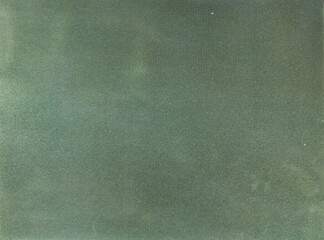 Green background. Velvet fleecy paper texture. Closeup