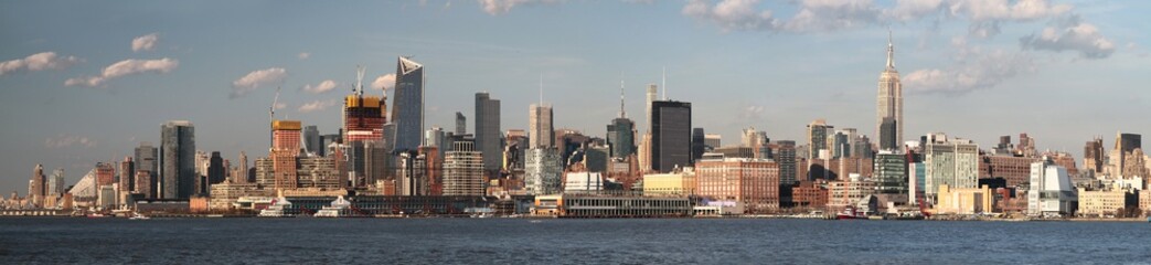 Fototapeta na wymiar Panoramic sunset view of Manhattan skyline from Hoboken. New York. USA.