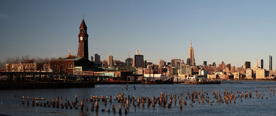 Panoramic sunset view of Manhattan skyline from Newport. New York. USA.