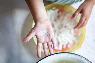 Detail of hands kneading dough