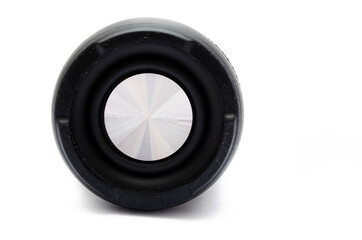 Wireless bluetooth color camouflage military column on a white background. The speaker lies on the...