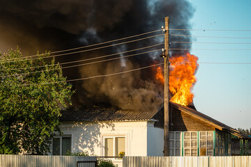 Flames from a burning house, a strong terrible fire